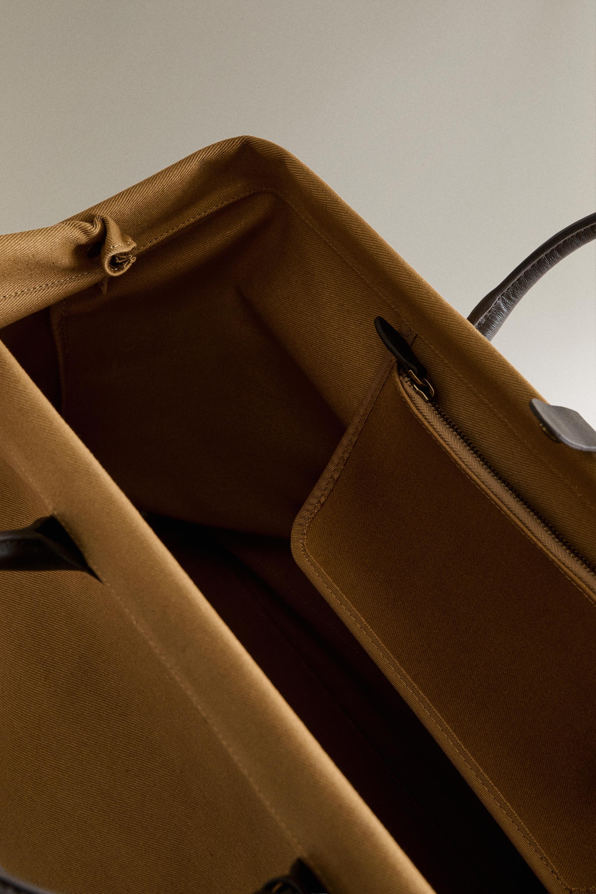 COTTON TRAVEL BAG WITH BUTTON CLOSURE